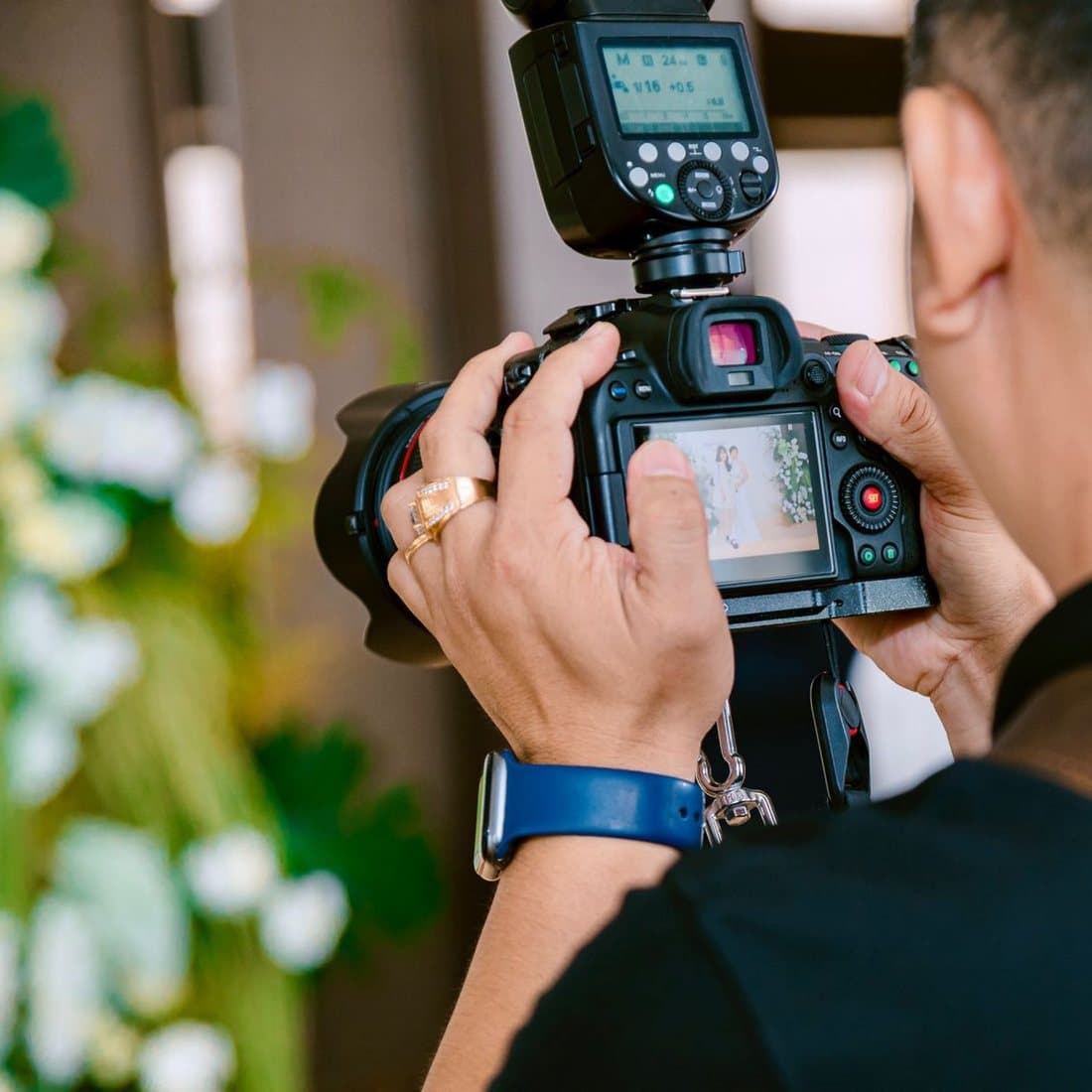 Photographer framing a couple at a wedding